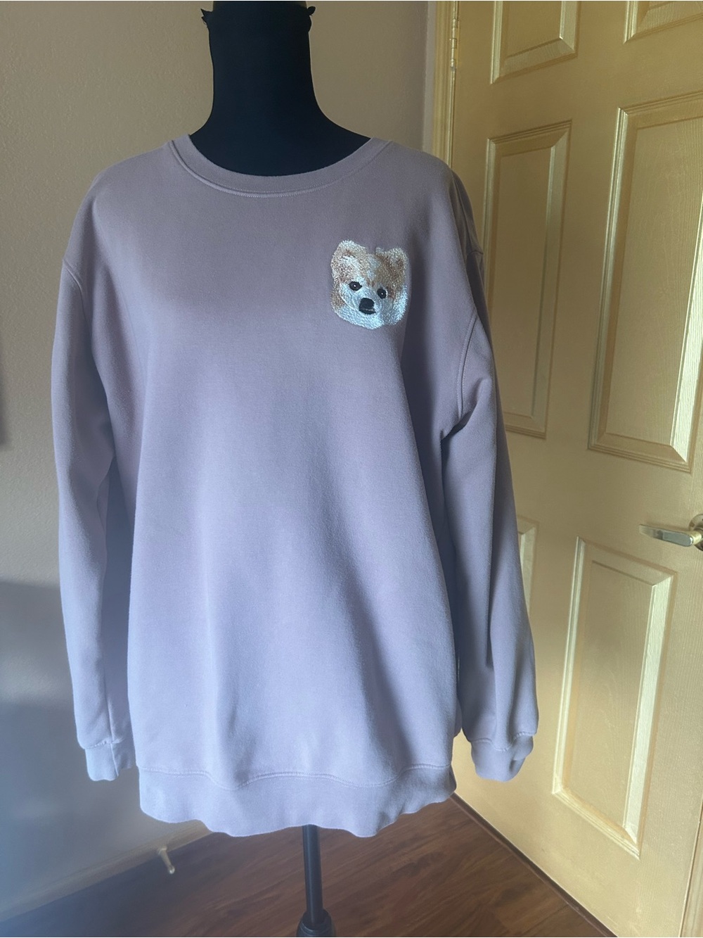 Pupsentials sweatshirt with Pomeranian embroidered on front.